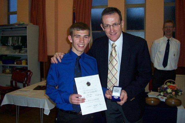 Andy Ross receiving Presidents Badge